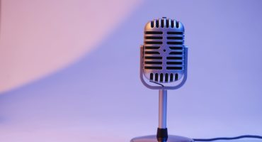 retro microphone isolated on color background